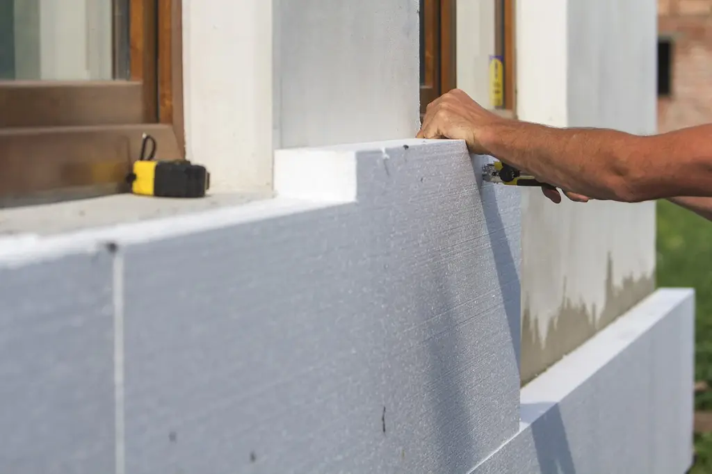 Construction worker installing insulation illustrating centralized customer management